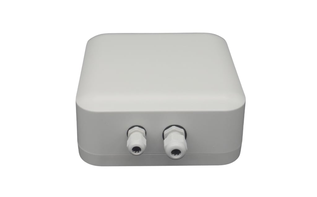 Compact white Creanode Gateway unit with rounded edges and two front-facing cable ports
