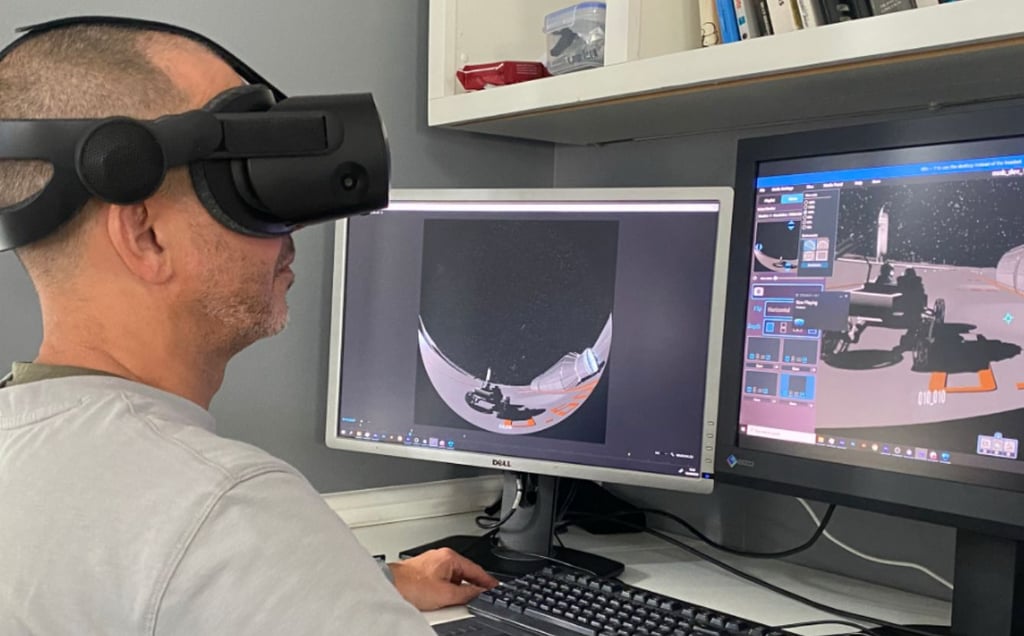 Person wearing a VR headset using Festoon software to view inside a virtual dome.