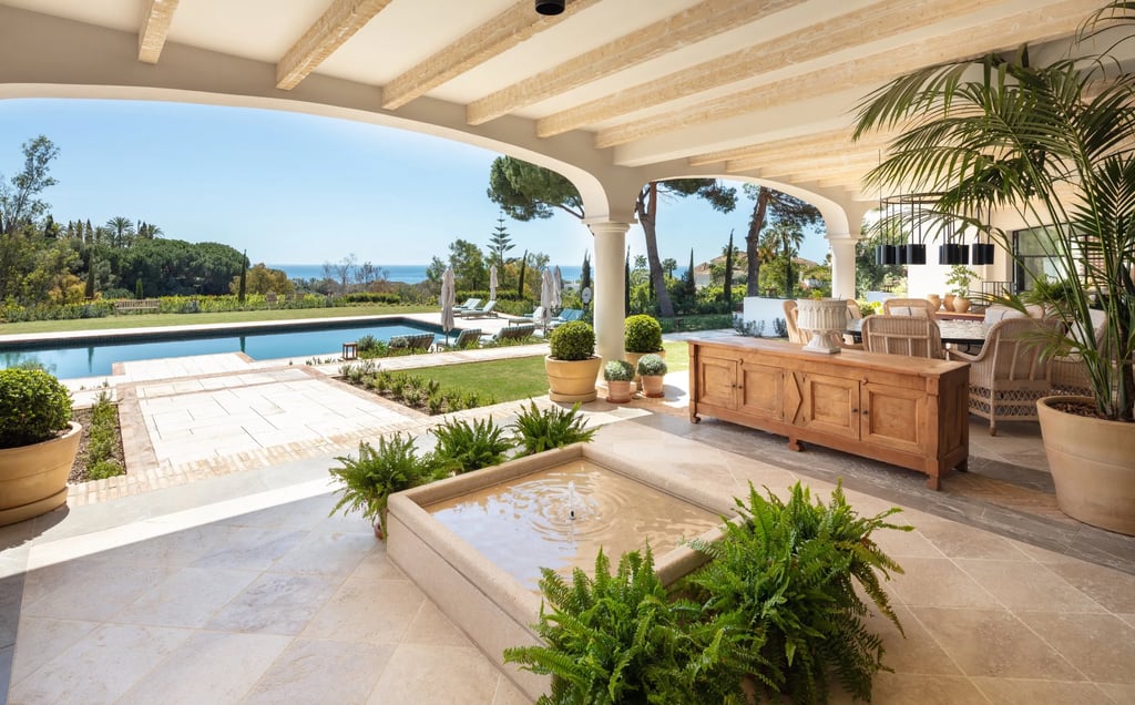 Terrace lounge at Villa La Gratitud with sea views and shaded pergola