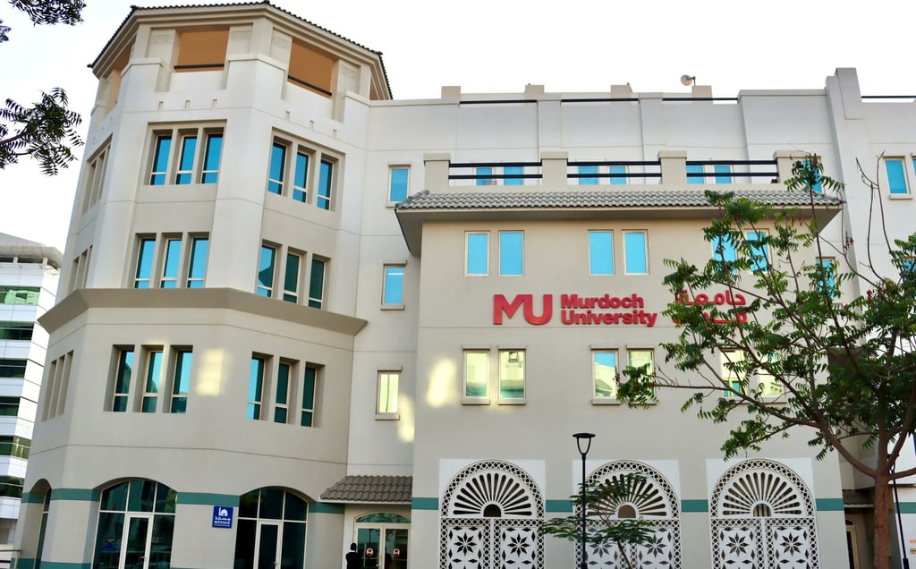 Exterior view of Murdoch University Dubai with arched windows, highlighting the institution