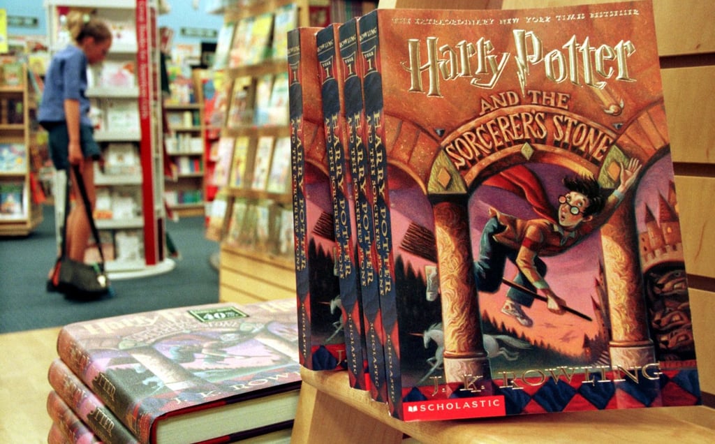  Copies of "Harry Potter and the Sorcerer's Stone" displayed in a bookstore, exemplifying the series