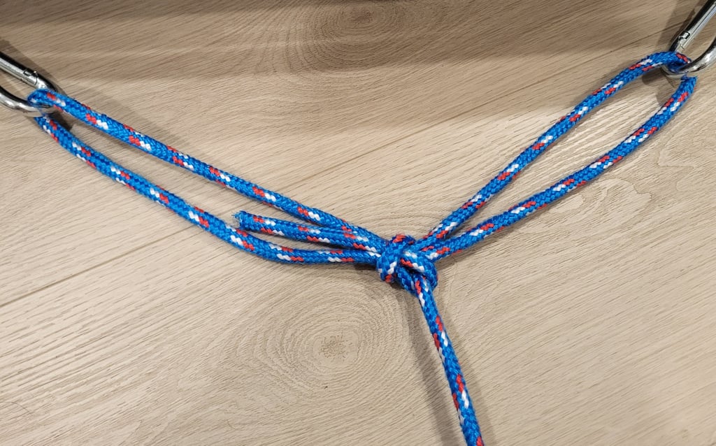 Portuguese Bowline suspended between two carabiners.