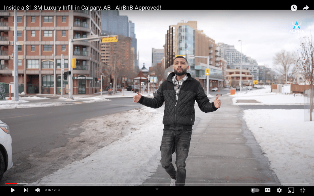 a man in a black jacket and a white shirt