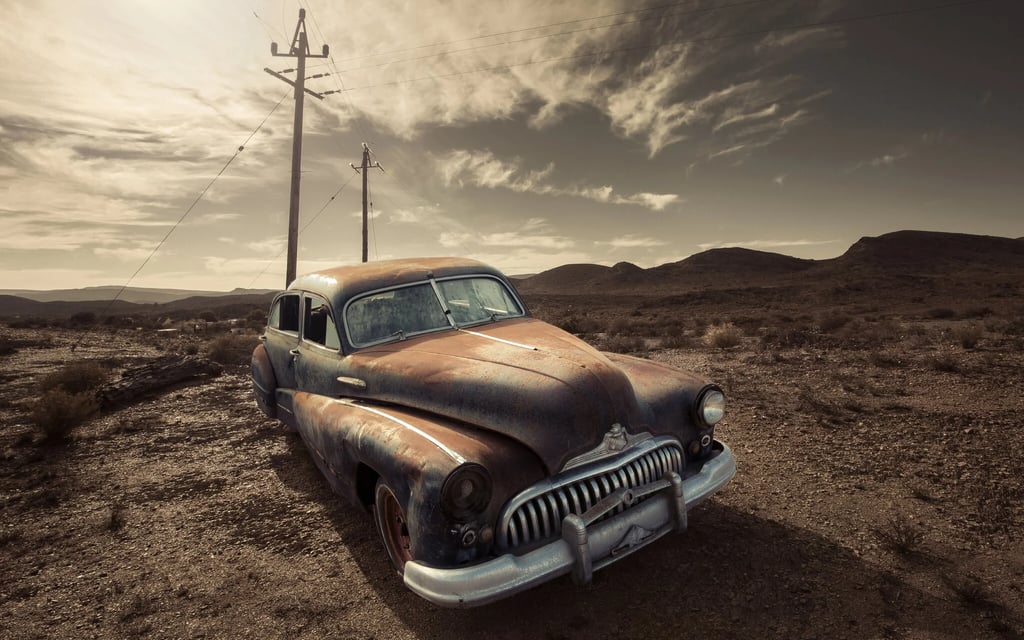 Abandoned vintage car on a hill near Klaarstroom in Martin Osner’s Abandoned No.36 photograph.