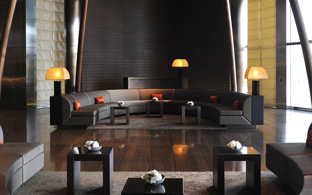 Minimalist lounge interior at Armani Hotel Dubai with curved seating and Armani Casa design elements.