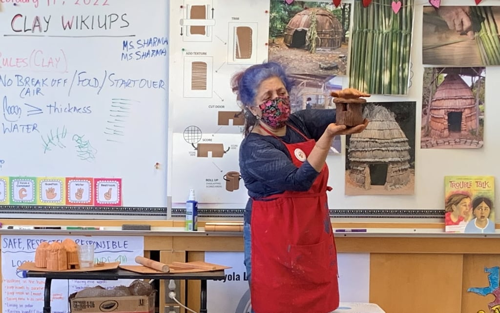docent teaching a clay lesson