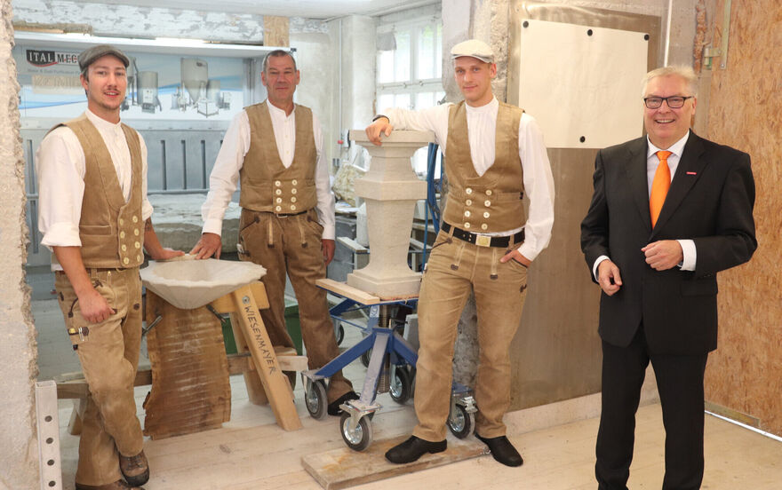 Tradition of the end-of-apprenticeship ceremony by Meister (master) Martin Weisenmayer (centre). So