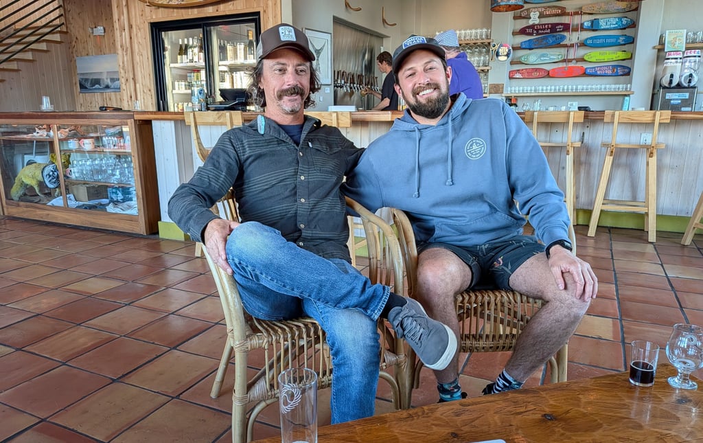 Brad Fitzgerald seated next to brewer Mike Swartz, Swells a Brewing