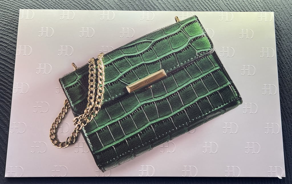 Close-up of Green Purse canvas texture on pearl textile backing