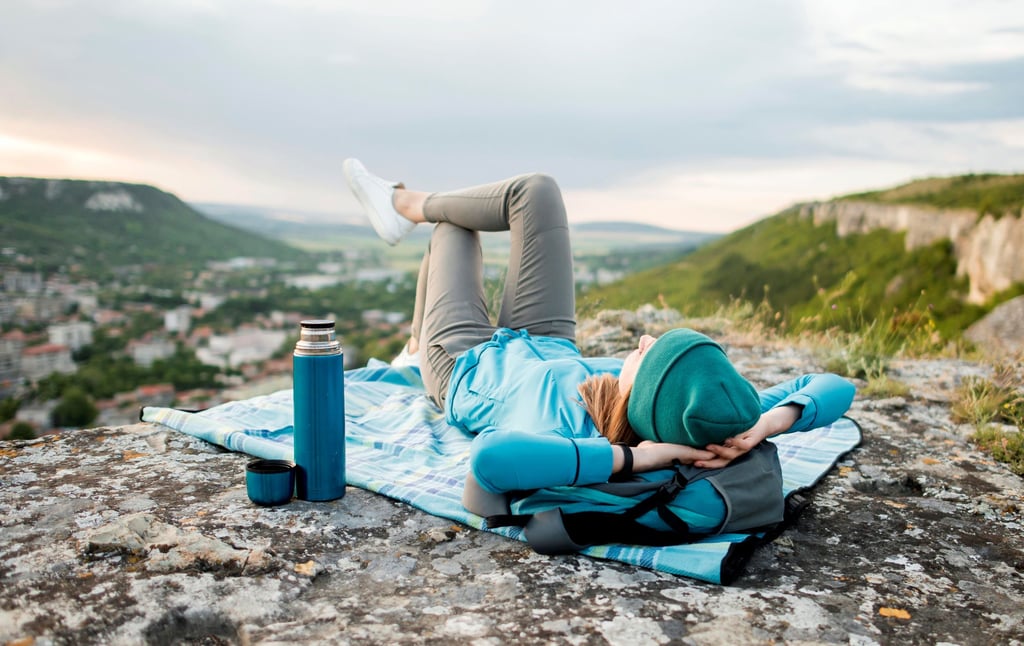 Traveller with beanie relaxing outdoors