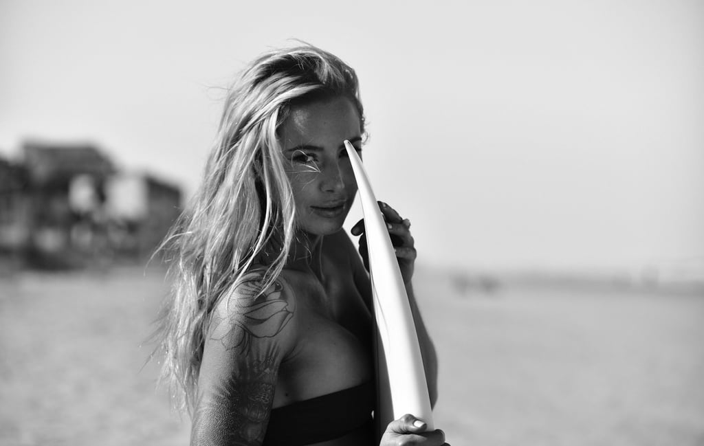 A portrait of a blonde surfer girl