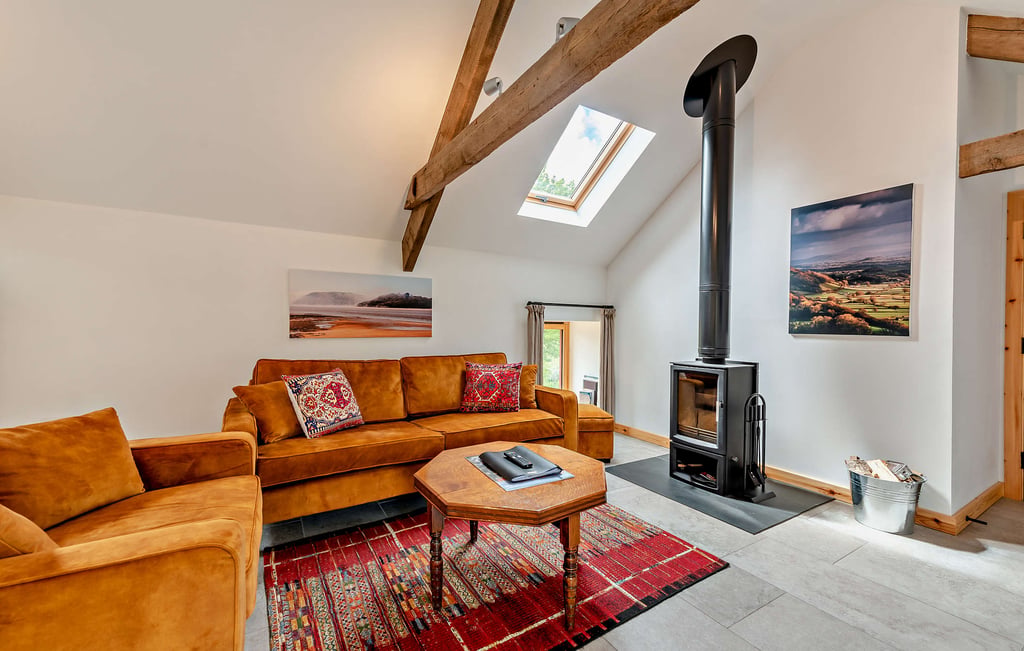 Your holiday cottage is fully equipped with a log burner and comfy seating.