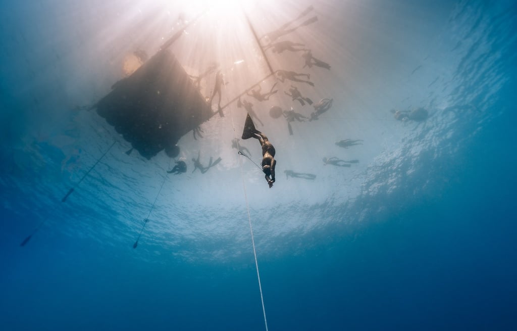 professional freediver descent underwater competition photo by Laura Mommicchi