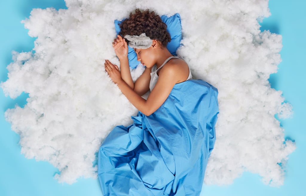 a woman sleeping in a cloud