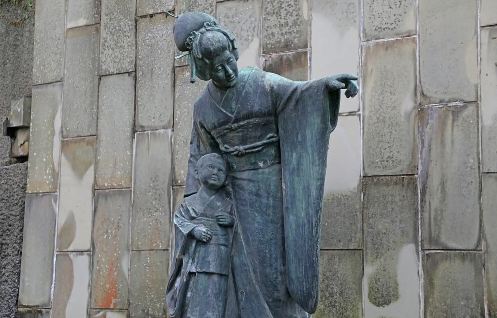 Statue of Miura Tamaki, the Japanese soprano famous for Madama Butterfly, standing in Glover Garden,