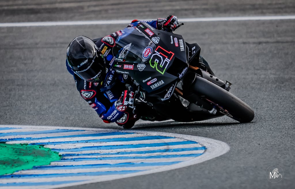 a person riding a motorcycle on a track