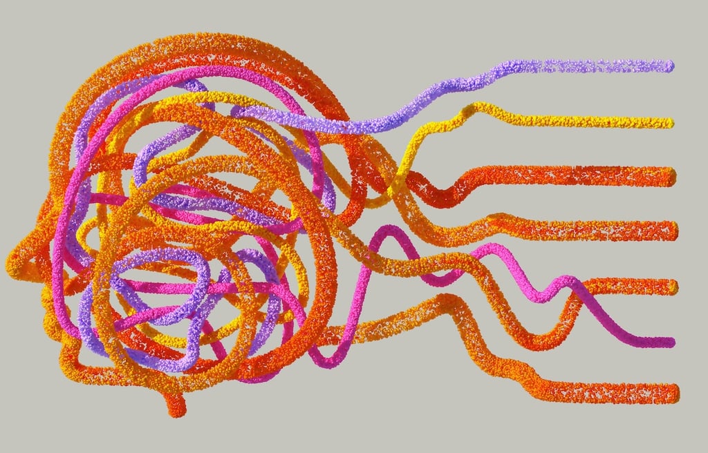 Colourful fibres making up the shape of a human head.
