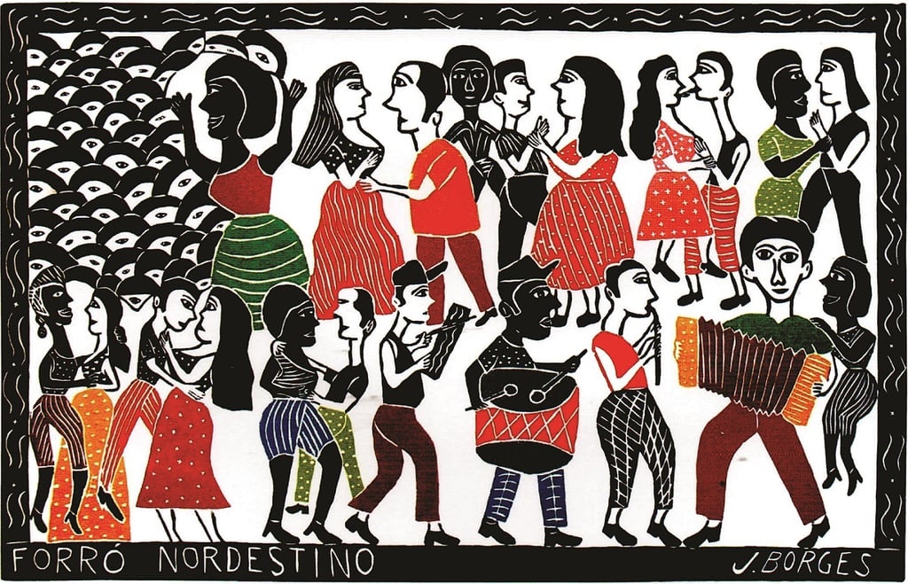 a group of people standing around a painting