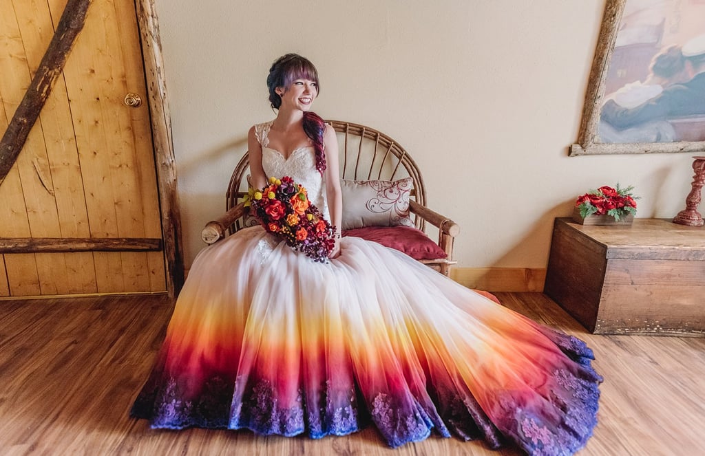 Bride in a sunset colored wedding dress with a matching bouquet and hair