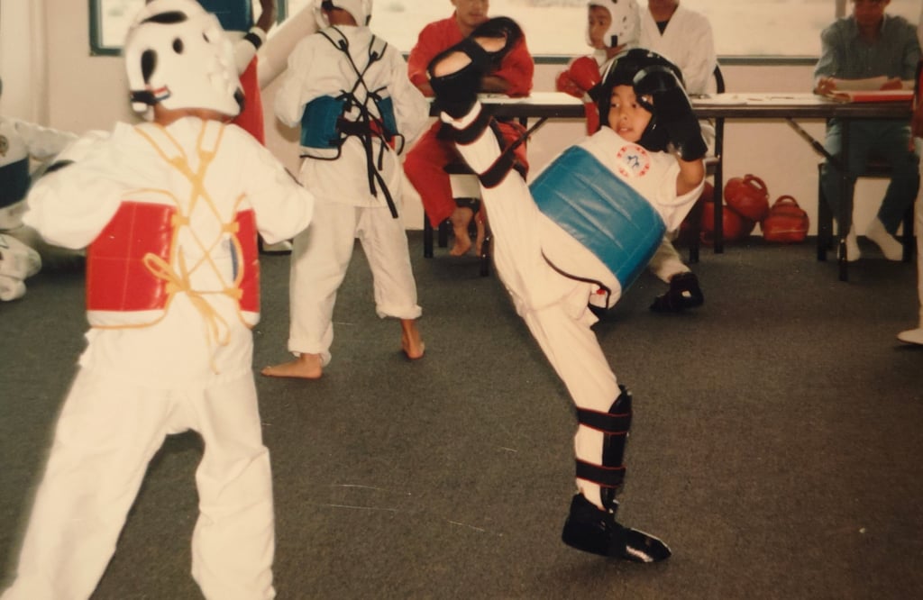 attempting to kick my opponent's face as he casually watches from afar