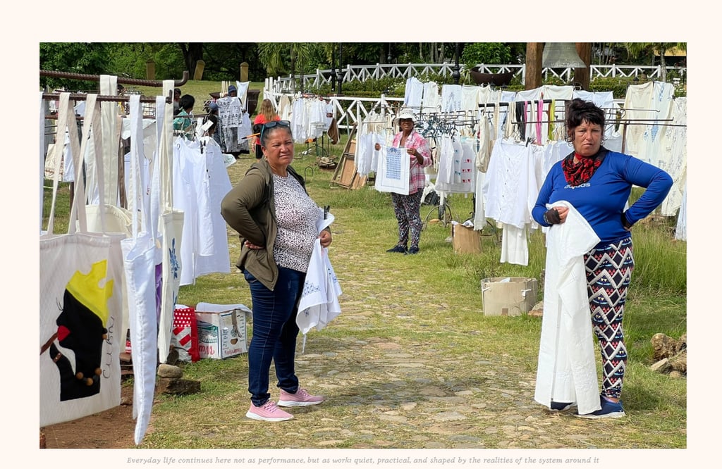 Women selling their embroidered clothing and decorations near Havana