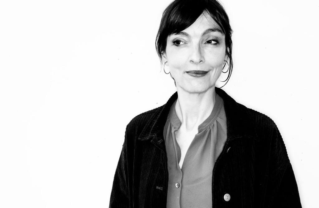 a woman with a black jacket and a black and white photo