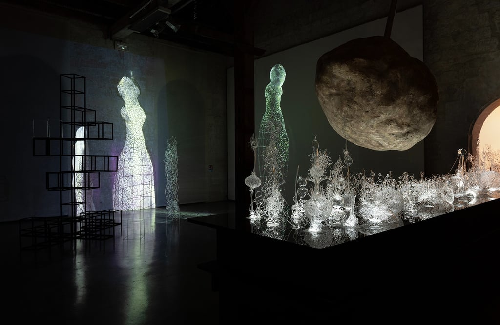 a room with video mapping and a lot of glass sculpture