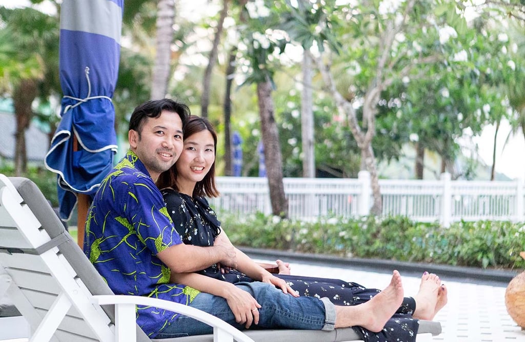 Couple relaxing on resort loungers at JW Marriott Phu Quoc