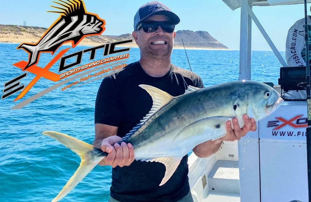 a man holding a fish fish on a boat