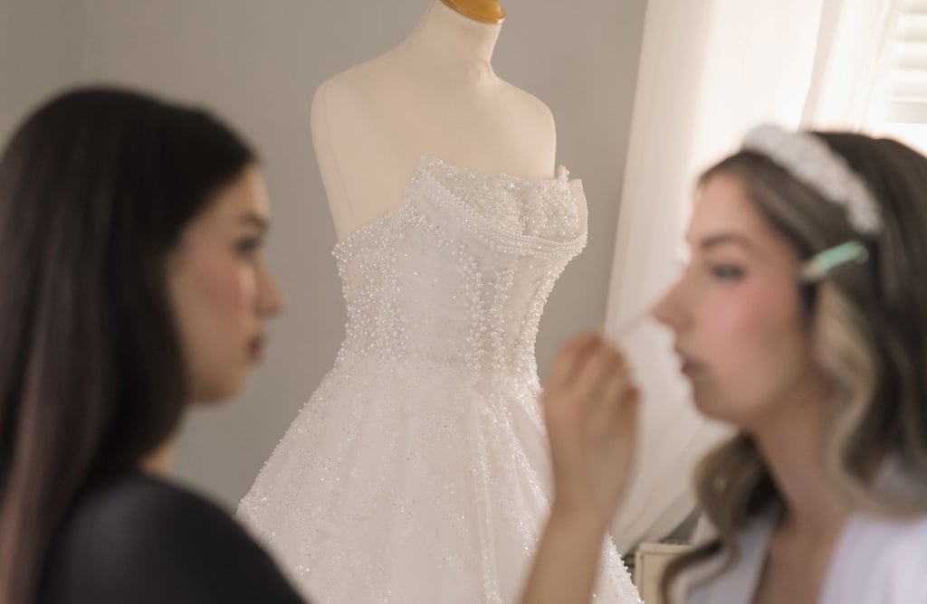Elegant bridal beauty look with classic winged eyeliner and soft pink lips photo on wedding morning