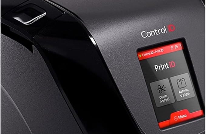 a printer machine with a control button on the side