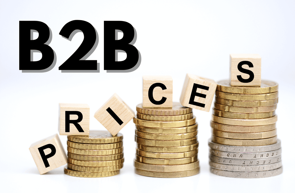 stacked coins with wooden blocks spelling B2B prices