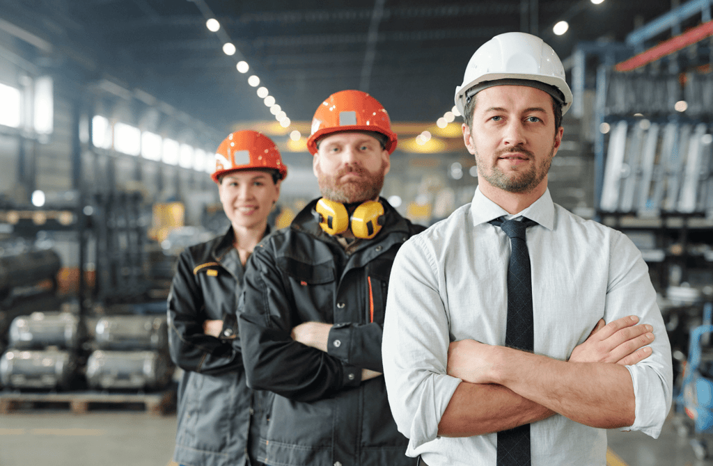 Industrial workers and manager in a factory