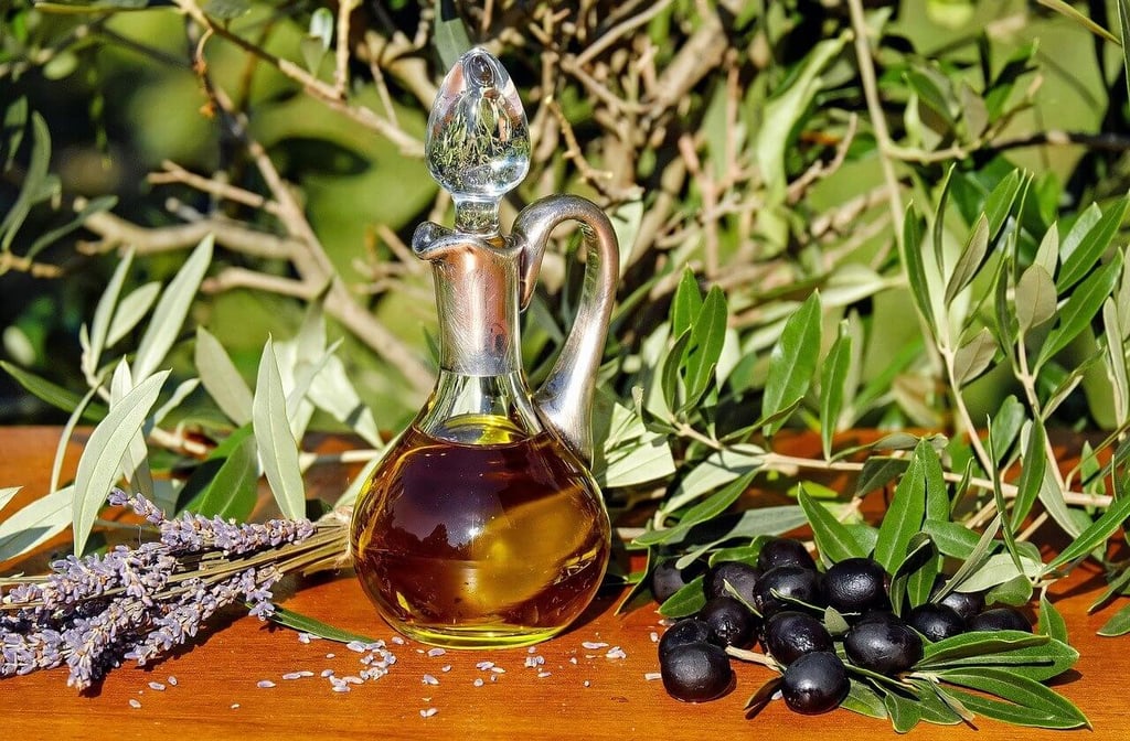 olive oil flask with olives and lavender