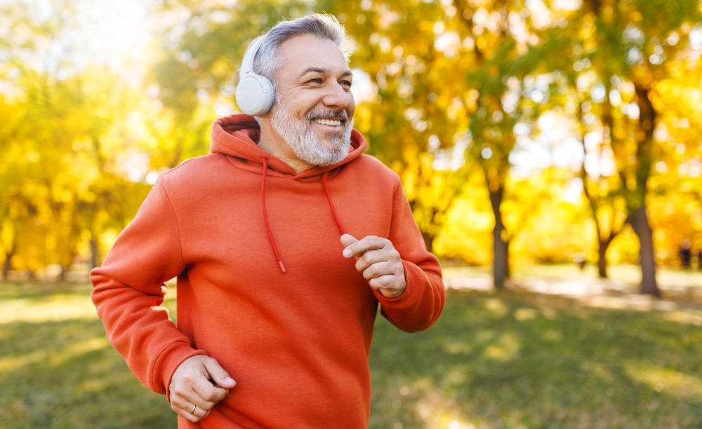 Middle maged man happy and running with confidence