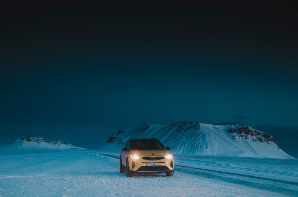a car driving on a snowy road