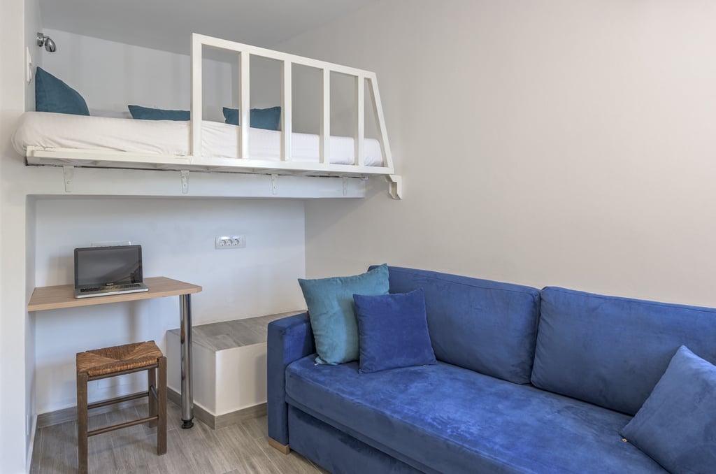 a couch with a loft bed