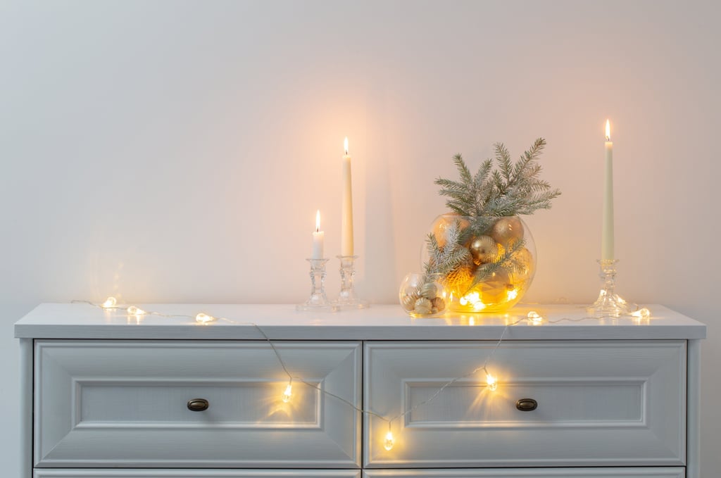 a dresser with candles and candles on it