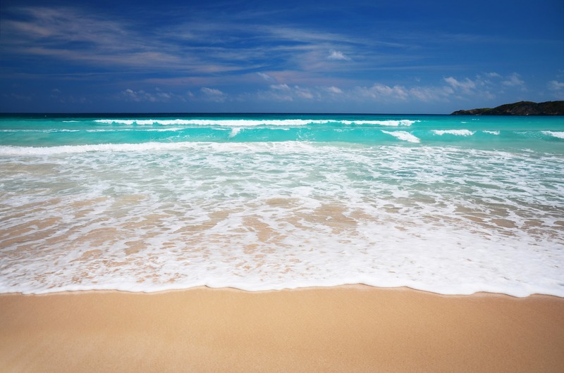 Turquoise waves and golden sand at Playa Macao in Punta Cana, Dominican Republic