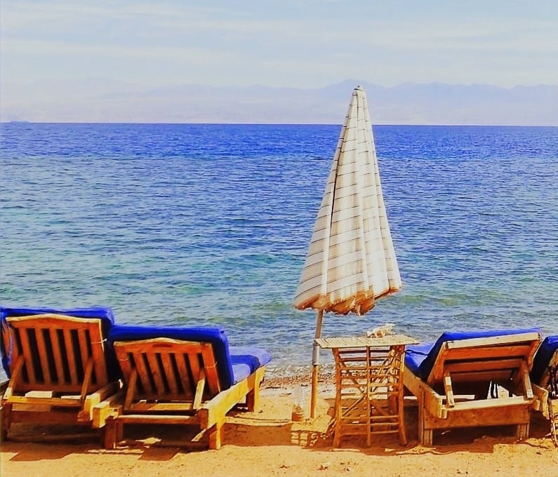 Relaxing in front of the sea on our chaise lounge