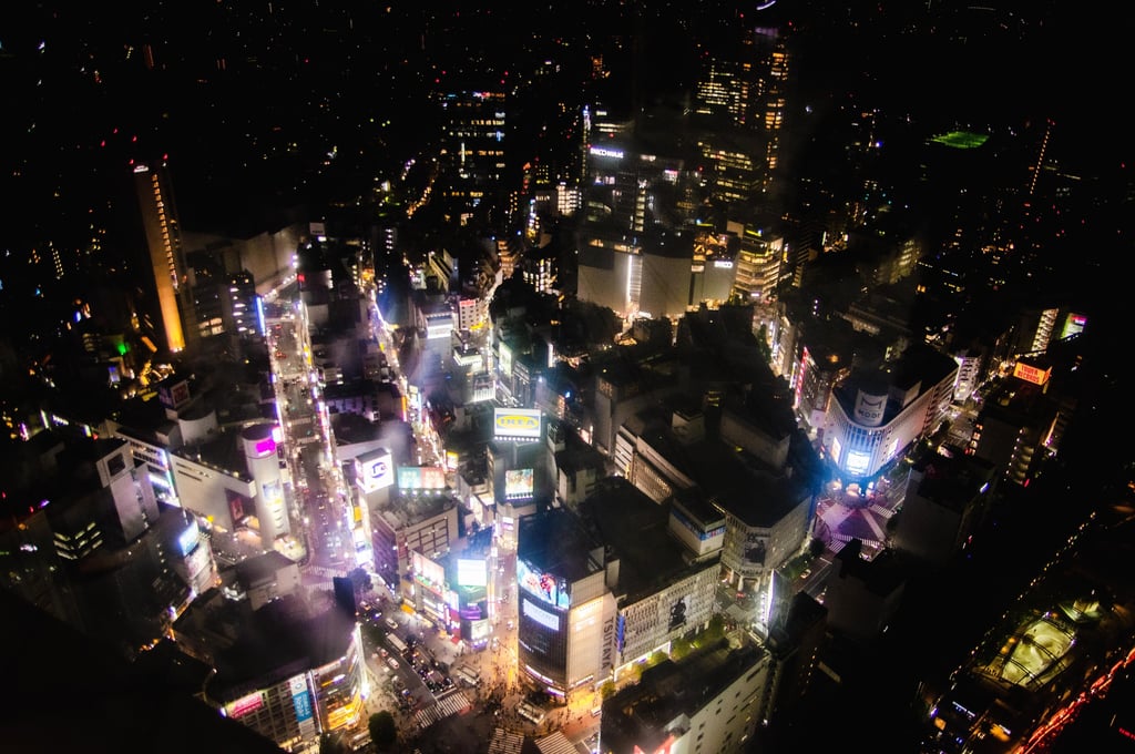 a cityscape of a city at night as viewed from Shibuya Sky