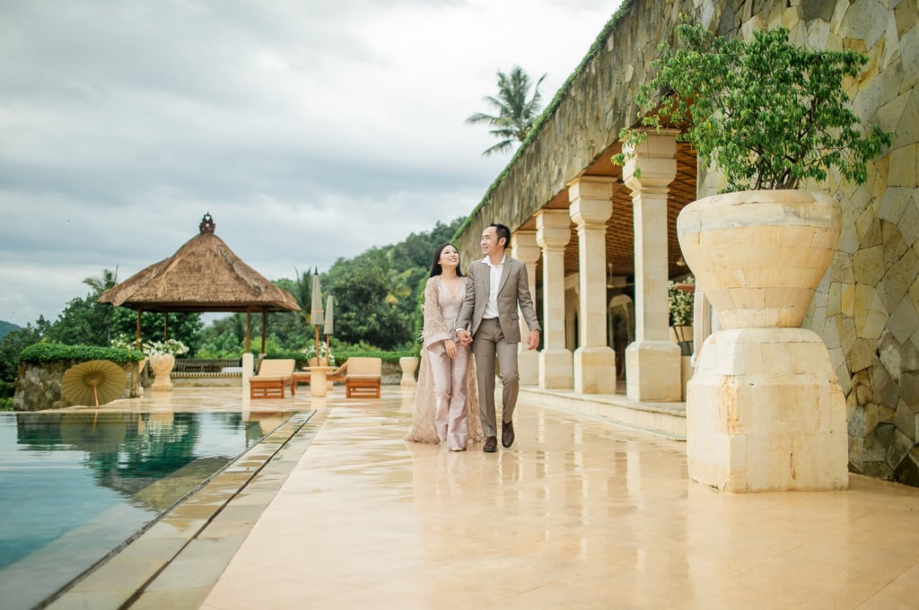 Luxury prewedding portrait along poolside corridor at Amankila Karangasem
