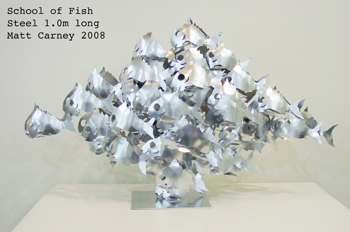 a sculpture of a school of fish