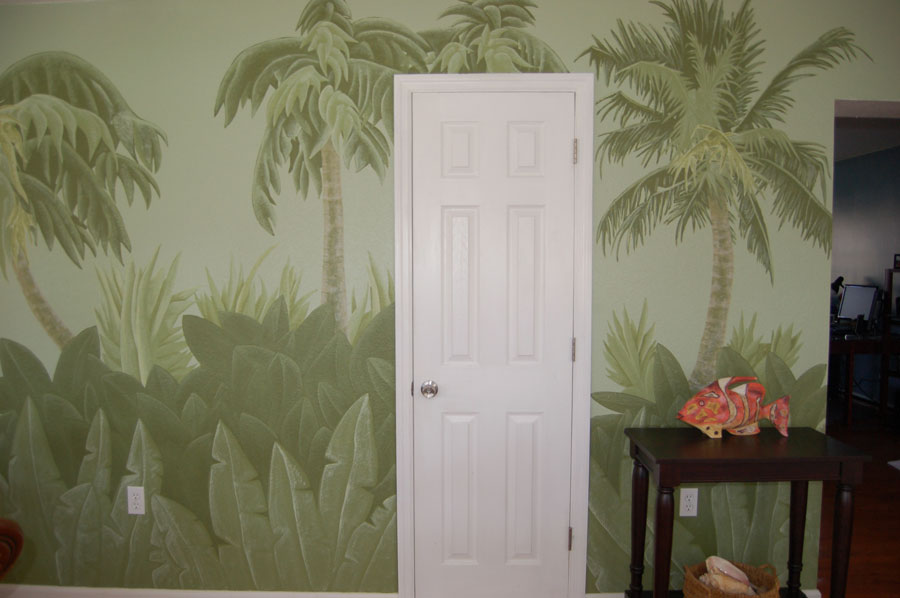A playful Florida scrub palms and palms interior wall mural in a mutlitude of greens painted by Kathy LaFollett.