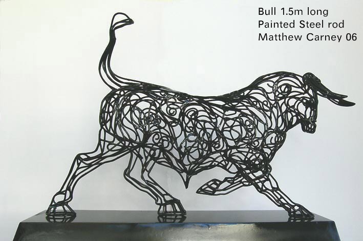 an intricate metal bull sculpture