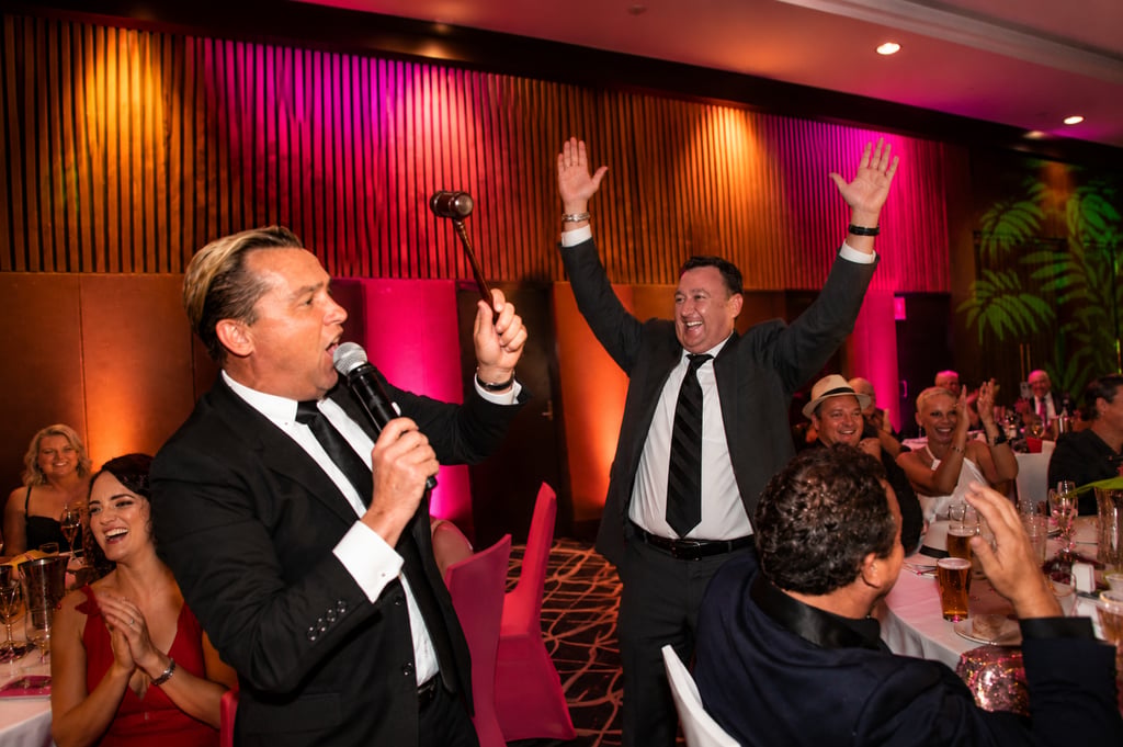 Professional charity fundraising auctioneer and gala emcee Craig Rosevear closing a dynamic bid at a