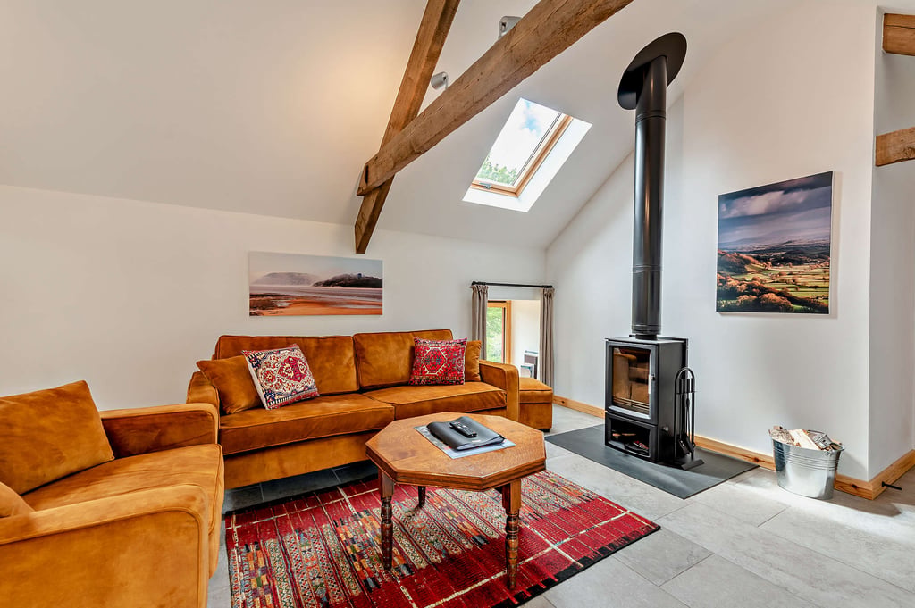 Your holiday cottage is fully equipped with a log burner and comfy seating.