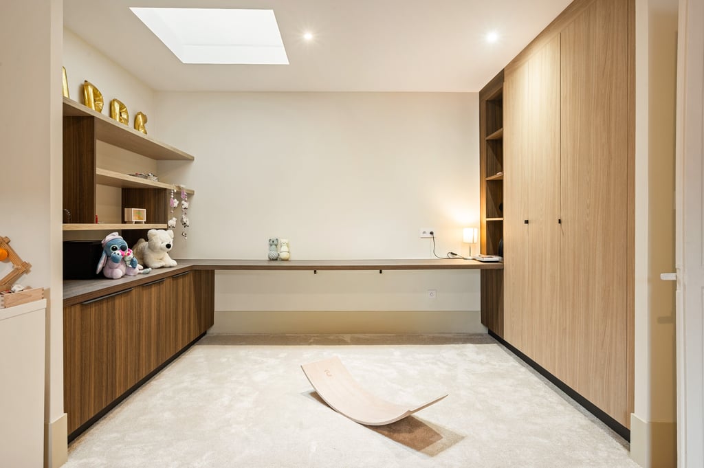 a room with a wooden floor and a wooden desk