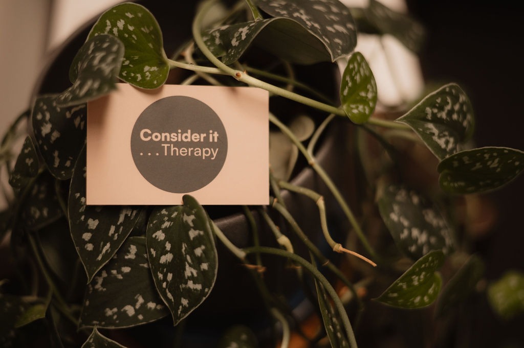 Consider it Therapy business card nestled in green plants — Glasgow therapy practice