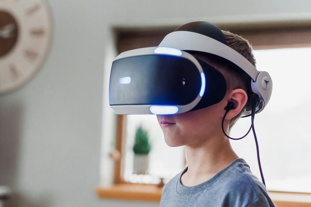 A boy wearing a virtual reality headset